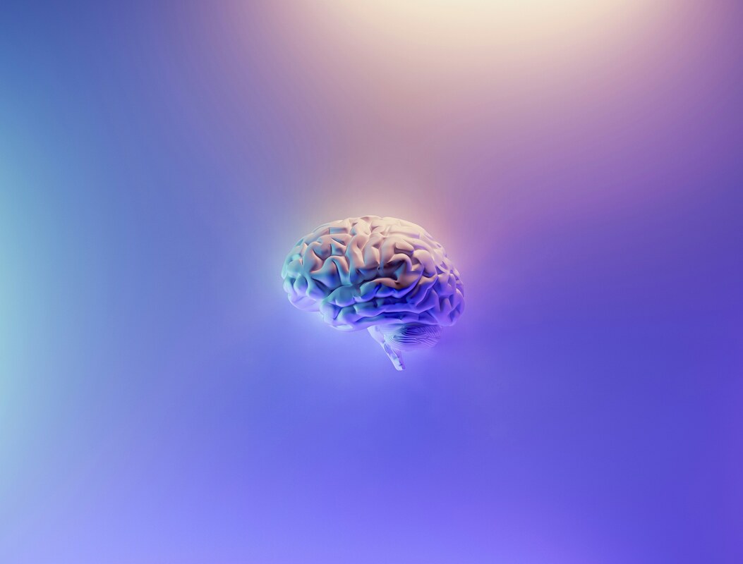 3D rendered brain floating in purple light